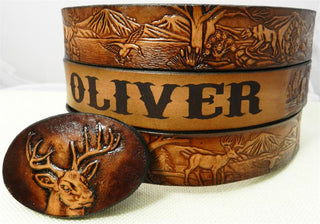 Kids' deer forest belt and buckle set featuring a three-piece silver-tone buckle with hand-tooled leather wildlife design.