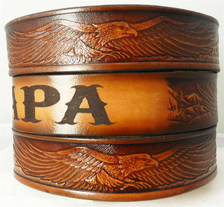 Hand-tooled leather belt with soaring eagle design and personalized name engraving, crafted from rich brown top-grain cowhide.
